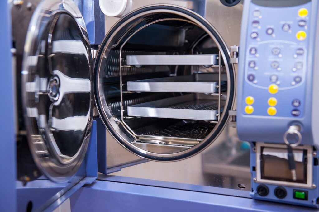 front view of a steam sterilizer with the door open